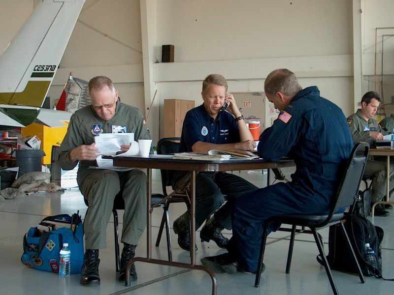 John_briefs_with_Jim_and_Craig