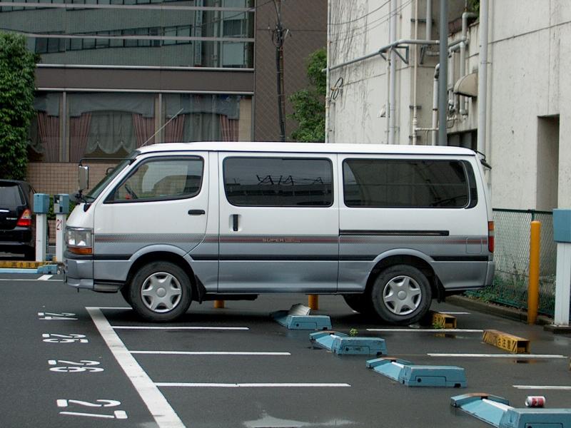 pay parking lot with flip-up tab in front of rear wheel