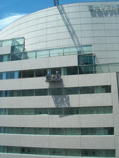 From the 20th floor of my hotel room, looking up at window-washers on the next building